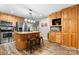 Renovated kitchen with stainless steel appliances, a center island, and wooden cabinetry at 220 Pinehurst Ln, Newton, NC 28658