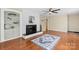 Cozy living room featuring a fireplace, hardwood floors, and built-in shelving for a welcoming atmosphere at 220 Pinehurst Ln, Newton, NC 28658