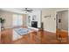 Inviting living room with hardwood floors, a fireplace, and large windows providing natural light at 220 Pinehurst Ln, Newton, NC 28658