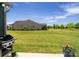Spacious backyard featuring lush green grass and a view of neighboring homes at 2329 Delaney Dr, Fort Mill, SC 29715