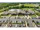 Aerial view of a community clubhouse, featuring a large pool and ample parking at 2329 Delaney Dr, Fort Mill, SC 29715