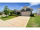 Charming single-Gathering home with a well-maintained lawn and two car garage at 2329 Delaney Dr, Fort Mill, SC 29715