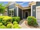 Inviting home entry featuring a well-landscaped walkway with lush plantings and a modern entry door at 2329 Delaney Dr, Fort Mill, SC 29715
