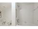 Bathroom featuring white tiled shower, separate toilet, and neutral finishes at 2445 Selwyn Ave # 104, Charlotte, NC 28209