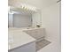 Bathroom featuring double vanities, large mirrors, and ample lighting, and neutral finishes at 2445 Selwyn Ave # 104, Charlotte, NC 28209