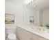 The bathroom features a long vanity, drawers, a toilet and framed art at 2445 Selwyn Ave # 104, Charlotte, NC 28209