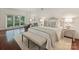This bedroom offers ample natural light, nice hardwood floors and neutral decor at 2445 Selwyn Ave # 104, Charlotte, NC 28209