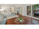 A luxurious bedroom boasts hardwood floors and access to a private balcony at 2445 Selwyn Ave # 104, Charlotte, NC 28209
