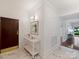 Well-lit hallway with marble flooring, stylish sconces, and a decorative table creates a welcoming entrance at 2445 Selwyn Ave # 104, Charlotte, NC 28209