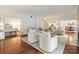 A stylish living room features hardwood floors, modern furniture, and open access to other rooms at 2445 Selwyn Ave # 104, Charlotte, NC 28209