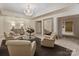 Elegant lobby featuring comfortable seating, chandelier, and ample space for relaxation and gatherings at 2445 Selwyn Ave # 104, Charlotte, NC 28209