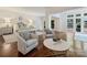 Spacious main bedroom with seating area and large windows providing ample natural light, complemented by hardwood floors at 2445 Selwyn Ave # 104, Charlotte, NC 28209