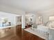 Spacious main bedroom with sitting area, desk, built-in shelves and large windows providing ample natural light at 2445 Selwyn Ave # 104, Charlotte, NC 28209