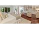 Spacious main bedroom with sitting area, built-in shelves and large windows providing ample natural light at 2445 Selwyn Ave # 104, Charlotte, NC 28209