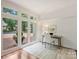 Home office with large windows and a view of the outside at 2445 Selwyn Ave # 104, Charlotte, NC 28209