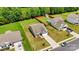 Aerial shot of a single-Gathering home with a spacious backyard, complemented by lush greenery and a fenced pool at 2928 Parkwest Dr, Albemarle, NC 28001