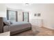 Comfortable bedroom featuring neutral paint, a large bed with stylish rug and a modern dresser at 2928 Parkwest Dr, Albemarle, NC 28001