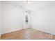 Bright bedroom featuring neutral paint, wood-look flooring and a window that brings soft natural light at 2928 Parkwest Dr, Albemarle, NC 28001