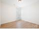 This bedroom is bright and open, with a neutral palette and wood-look flooring, complemented by soft window lighting at 2928 Parkwest Dr, Albemarle, NC 28001