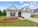 Lovely single-Gathering home with a two-car garage, well-maintained lawn, and attractive landscaping during daylight at 2928 Parkwest Dr, Albemarle, NC 28001
