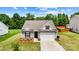 Beautiful single-Gathering home with a well-maintained lawn and landscaping, showcasing curb appeal on a sunny day at 2928 Parkwest Dr, Albemarle, NC 28001