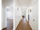 Bright hallway with hard floors and white walls leads to various rooms at 2928 Parkwest Dr, Albemarle, NC 28001