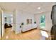 Finished basement area with wood floors, recessed lighting, and access to the exterior at 3549 Woodleaf Rd, Charlotte, NC 28205