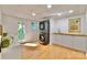 Finished basement featuring in-unit laundry with cabinetry and outdoor access at 3549 Woodleaf Rd, Charlotte, NC 28205