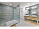 Stylish bathroom featuring double sink, modern vanity, and a large glass-enclosed shower at 3549 Woodleaf Rd, Charlotte, NC 28205