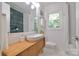 Clean bathroom with modern vessel sink and vanity, offering a serene and functional space at 3549 Woodleaf Rd, Charlotte, NC 28205