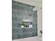 Beautiful bathroom detail with stylish blue tile and niche, showcasing a modern and clean space at 3549 Woodleaf Rd, Charlotte, NC 28205