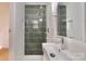 This modern bathroom features sleek tiling, a walk-in shower, and updated fixtures at 3549 Woodleaf Rd, Charlotte, NC 28205