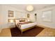 Inviting bedroom with a cozy bed, stylish decor, and ample natural light at 3549 Woodleaf Rd, Charlotte, NC 28205