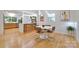 Elegant dining space with stylish table set, open to a sleek, modern kitchen with bar seating at 3549 Woodleaf Rd, Charlotte, NC 28205