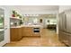 Kitchen with an open concept to the living area and stainless steel appliances at 3549 Woodleaf Rd, Charlotte, NC 28205