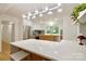 Open kitchen featuring an island with marble countertops and stainless steel appliances at 3549 Woodleaf Rd, Charlotte, NC 28205