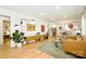 An open-concept living room with hardwood floors, modern lighting, and stylish decor at 3549 Woodleaf Rd, Charlotte, NC 28205