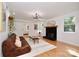 Bright living room with hardwood floors, a fireplace, and comfortable seating area at 3549 Woodleaf Rd, Charlotte, NC 28205