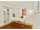 Bright home office featuring a white desk, modern decor, and natural light at 3549 Woodleaf Rd, Charlotte, NC 28205
