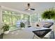 Relaxing screened porch area with comfortable seating and natural light at 3549 Woodleaf Rd, Charlotte, NC 28205