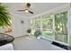 Cozy screened-in porch with comfortable seating, offering a peaceful outdoor experience at 3549 Woodleaf Rd, Charlotte, NC 28205