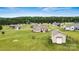 Aerial view of a home with an outbuilding on a spacious lot within a friendly neighborhood setting, blending privacy and community at 3645 Kimber Ln, Sherrills Ford, NC 28673
