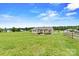 Large, well-maintained backyard featuring a covered patio and expansive green space at 3645 Kimber Ln, Sherrills Ford, NC 28673