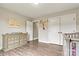 Neutral-toned Bedroom featuring a crib, a spacious dresser, and a view into the hallway at 3645 Kimber Ln, Sherrills Ford, NC 28673