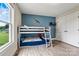 Bright bedroom featuring a bunk bed, wood-look floors, and natural light from the window at 3645 Kimber Ln, Sherrills Ford, NC 28673