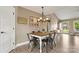 Cozy dining room featuring a wooden table, metal chairs, stylish lighting, and decorative wall art at 3645 Kimber Ln, Sherrills Ford, NC 28673