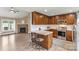 Beautiful kitchen with granite counters, stainless appliances, a breakfast bar, and a stone fireplace at 3645 Kimber Ln, Sherrills Ford, NC 28673