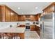 Well-equipped kitchen featuring granite countertops, stainless steel appliances, and wood cabinetry at 3645 Kimber Ln, Sherrills Ford, NC 28673