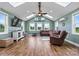 Bright living room with vaulted ceilings, skylights, wood floors, and comfortable seating area at 3645 Kimber Ln, Sherrills Ford, NC 28673