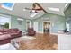 Inviting living room featuring hardwood floors, a vaulted ceiling with skylights, and comfortable seating arrangements at 3645 Kimber Ln, Sherrills Ford, NC 28673